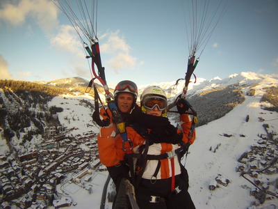 Tandem paragliding flight over La Clusaz, Haute Savoie Tandem paragliding flight over La Clusaz, Haute Savoie